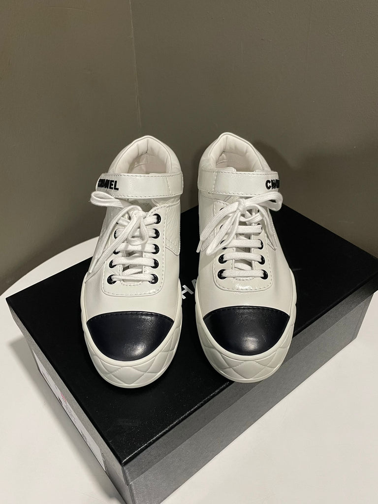 Chanel 23A Sneaker
White / Black Glazed Calf 
Size 38