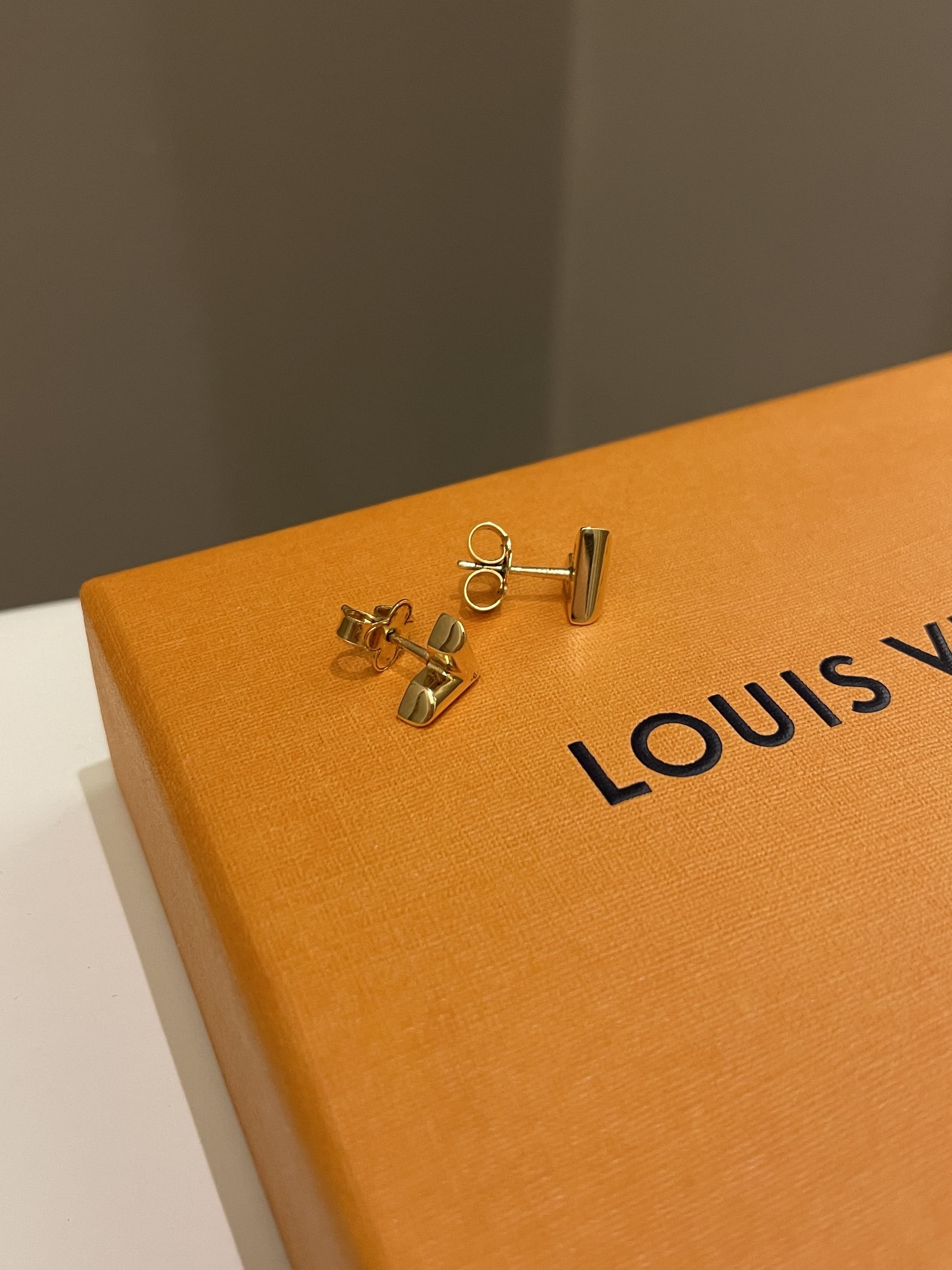 Louis Vuitton Gold Tone Essential V Stud Earrings Louis Vuitton