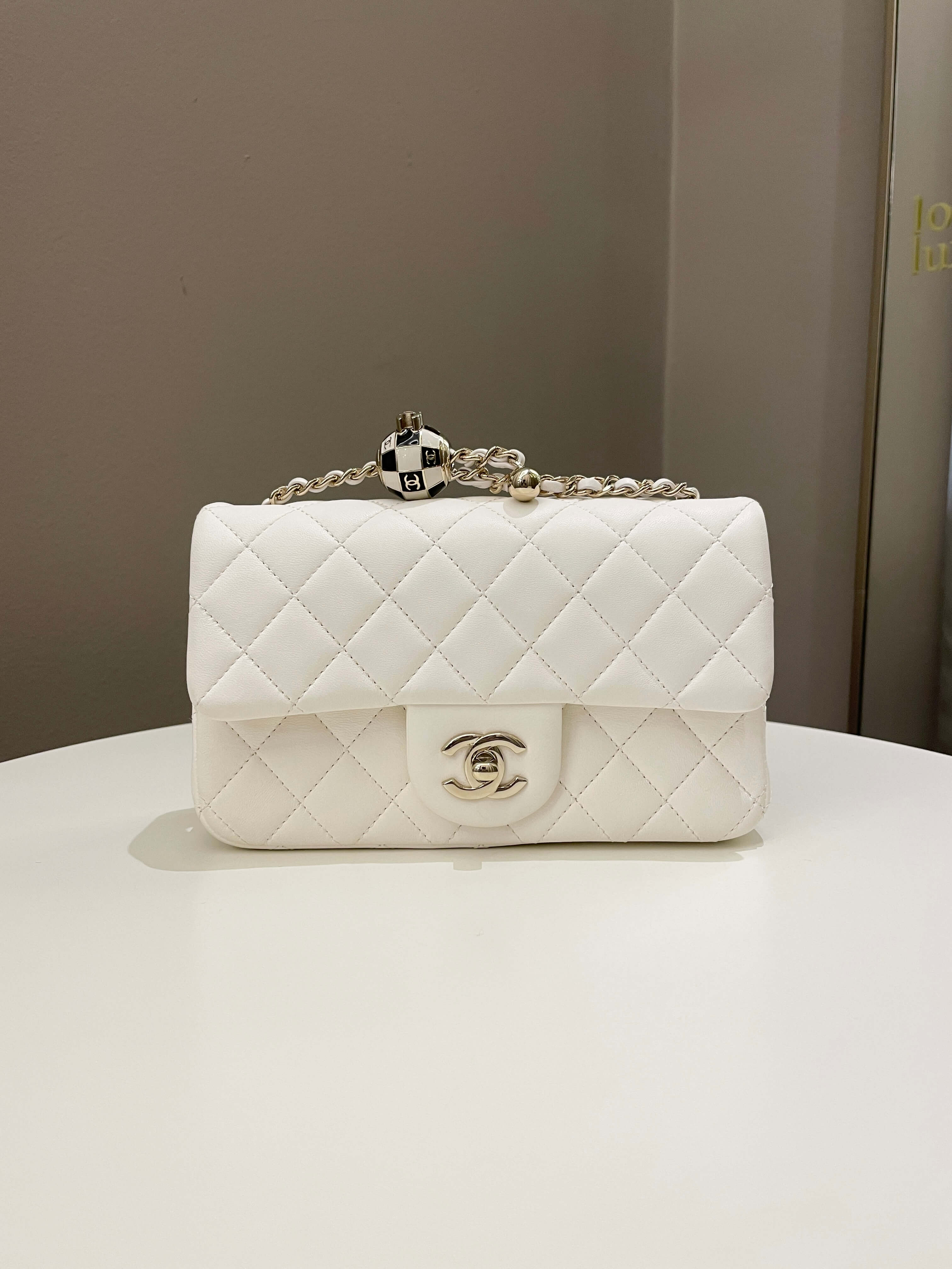 Chanel Pearl Crush Quilted Mini Rectangular
Ivory Stiff Lambskin