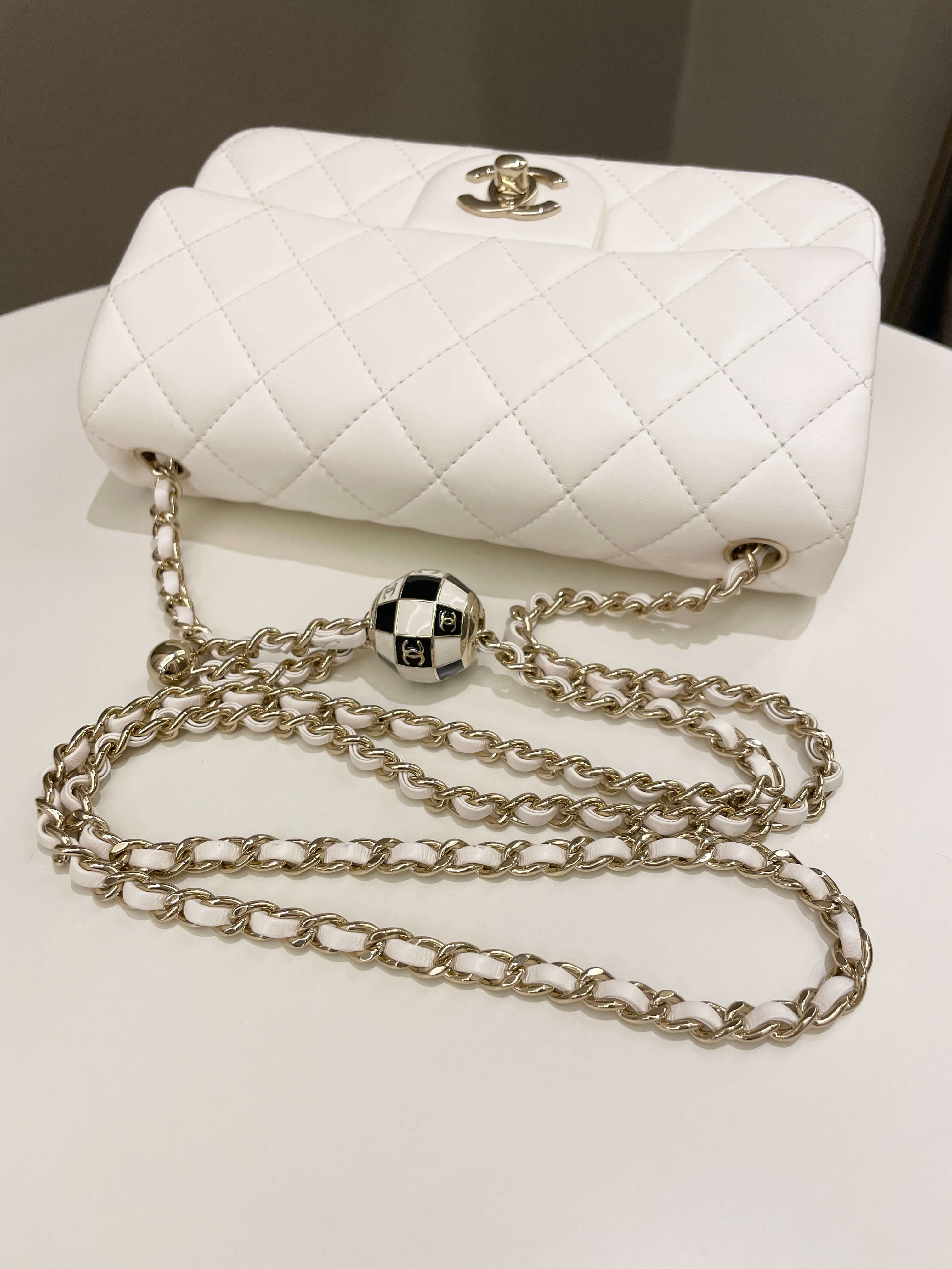 Chanel Pearl Crush Quilted Mini Rectangular
Ivory Stiff Lambskin
