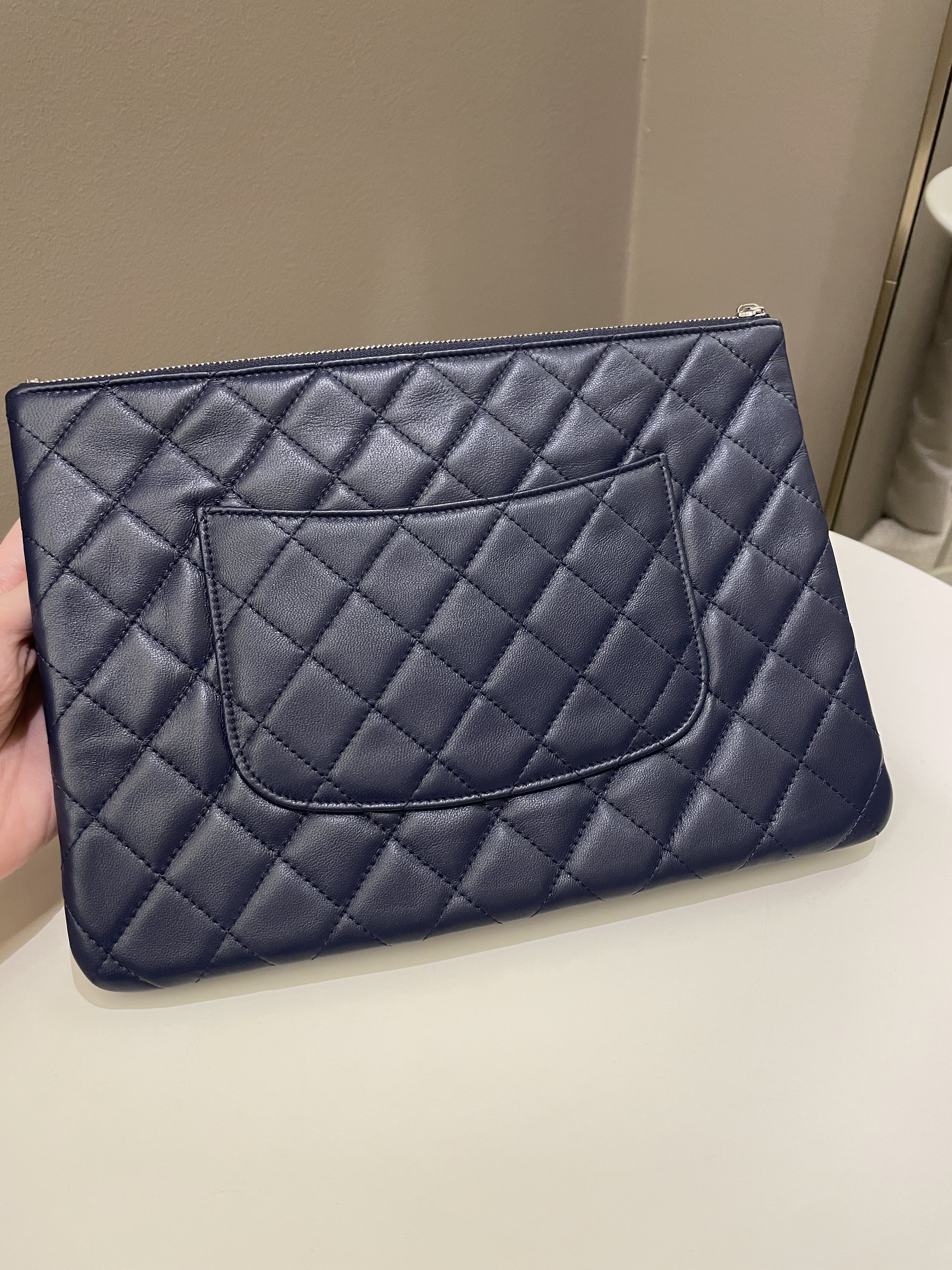Chanel Quilted Leather Multi Pocket Zip Clutch
Multicolor