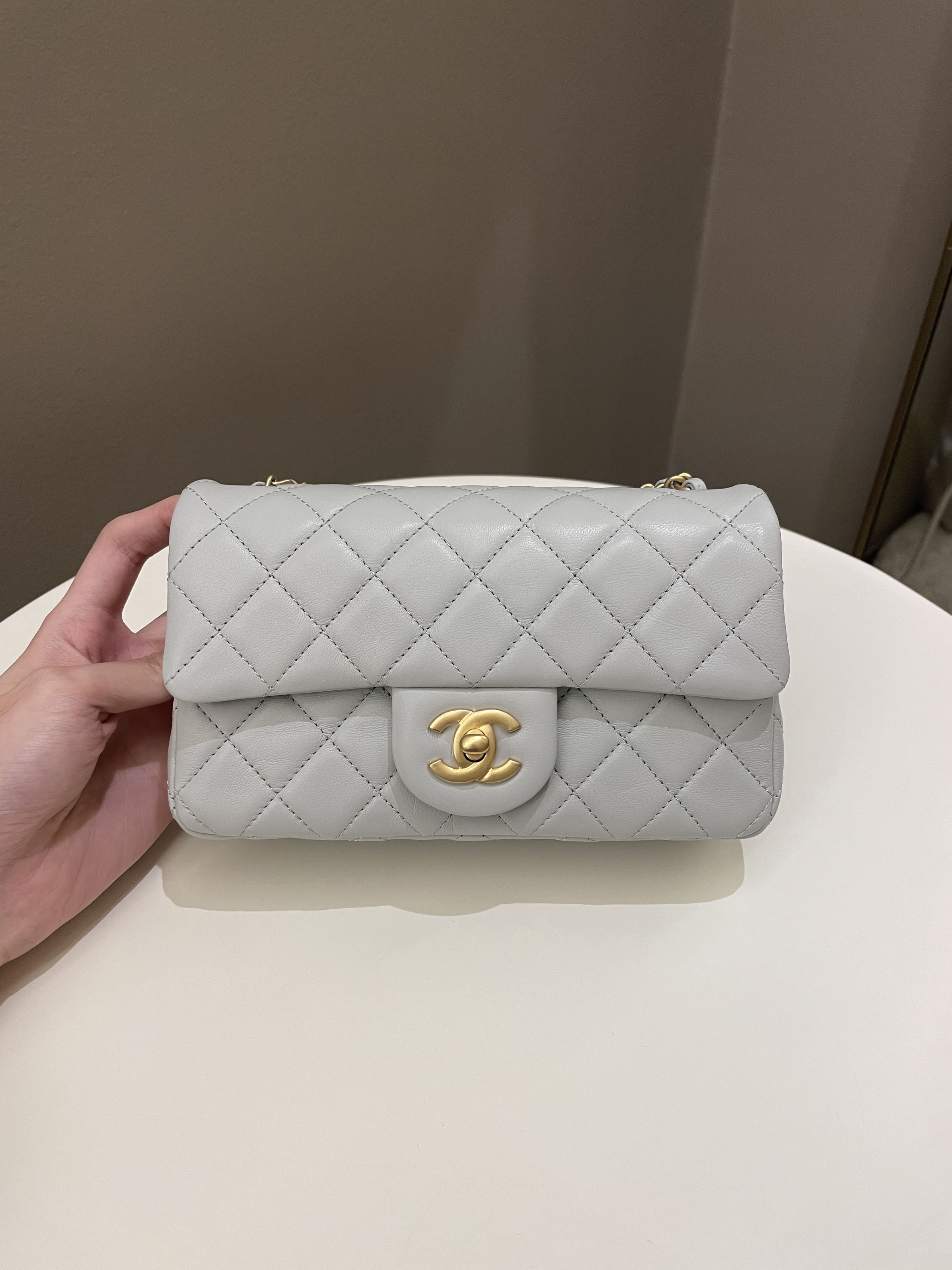 Chanel Pearl Crush 22c mini rectangular flap bag white lambskin with  gold-tone metal, Luxury, Bags & Wallets on Carousell