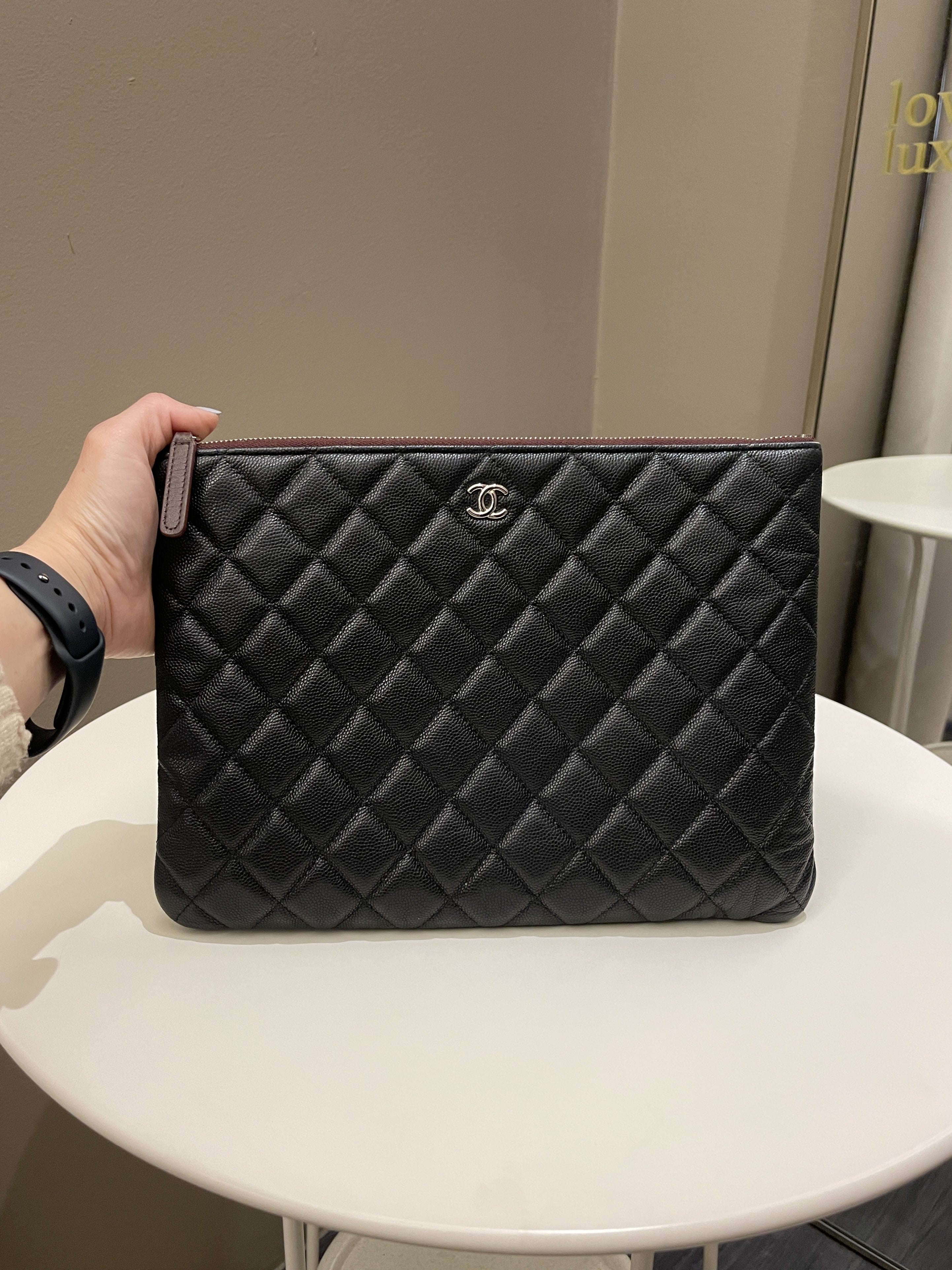 Chanel Classic Quilted Ocase Clutch
Black Caviar