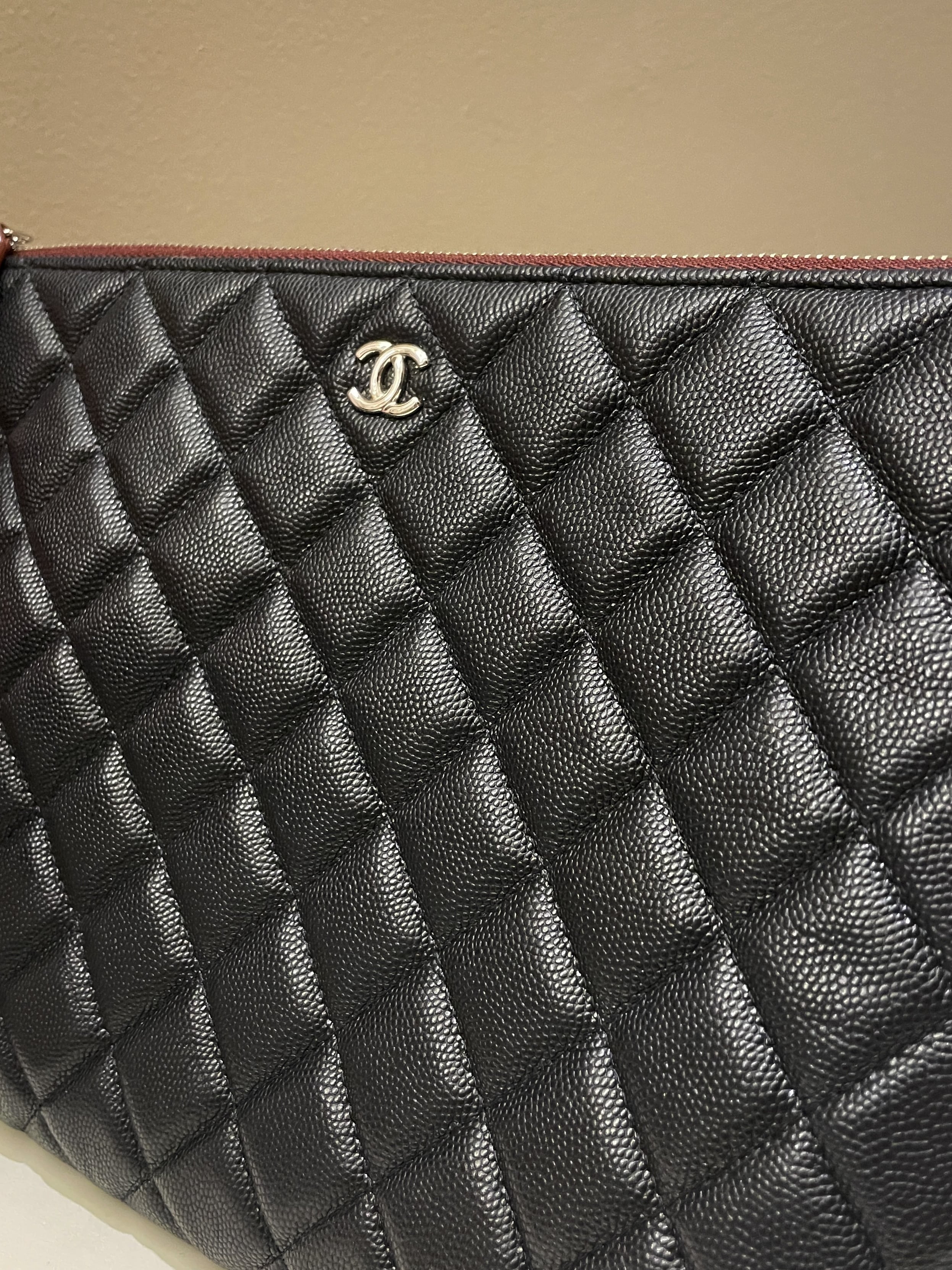 Chanel Classic Quilted Ocase Clutch
Black Caviar