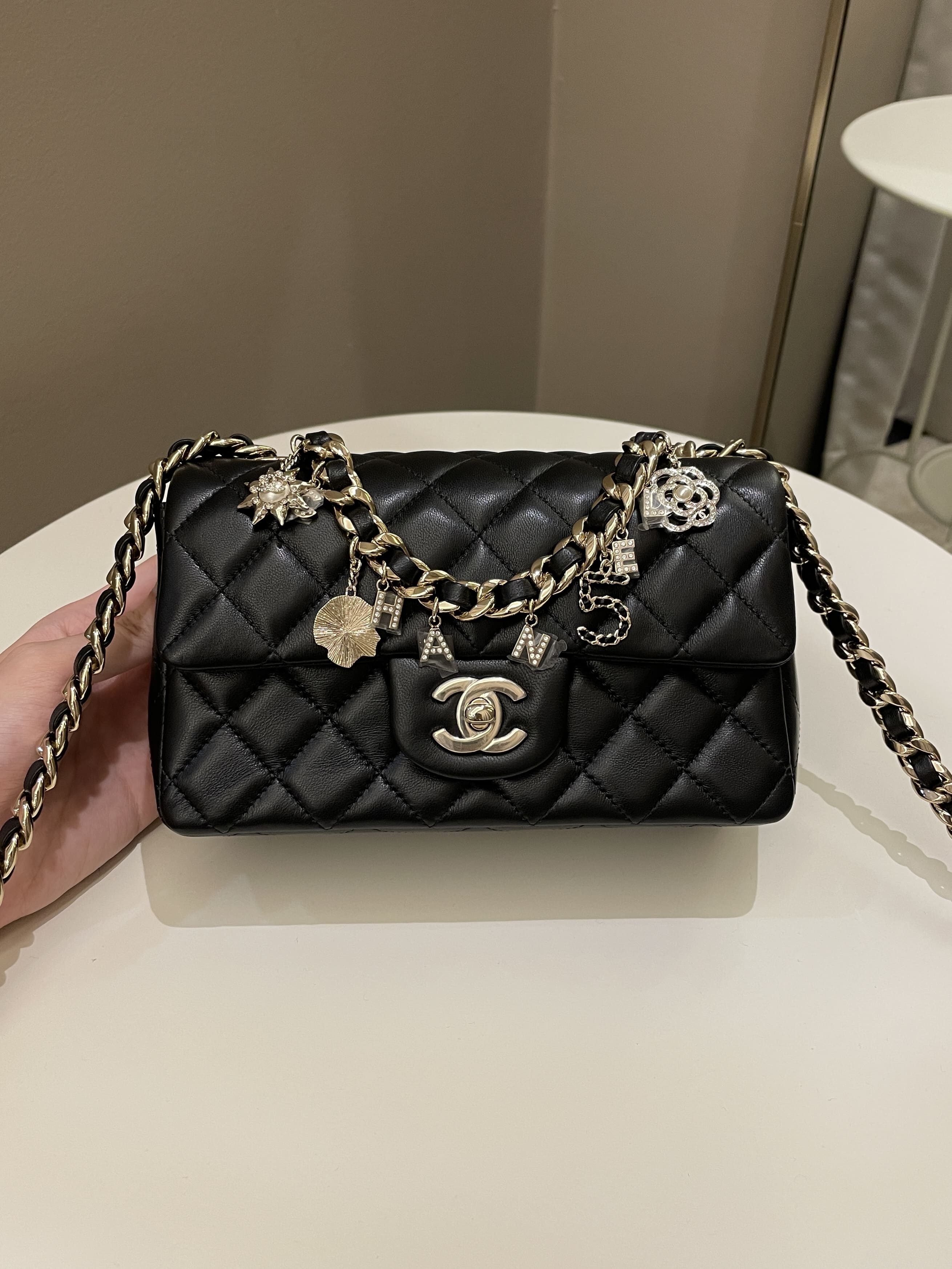 Chanel Quilted Mini Coco Charms Rectangular Flap Black Lambskin –  ＬＯＶＥＬＯＴＳＬＵＸＵＲＹ