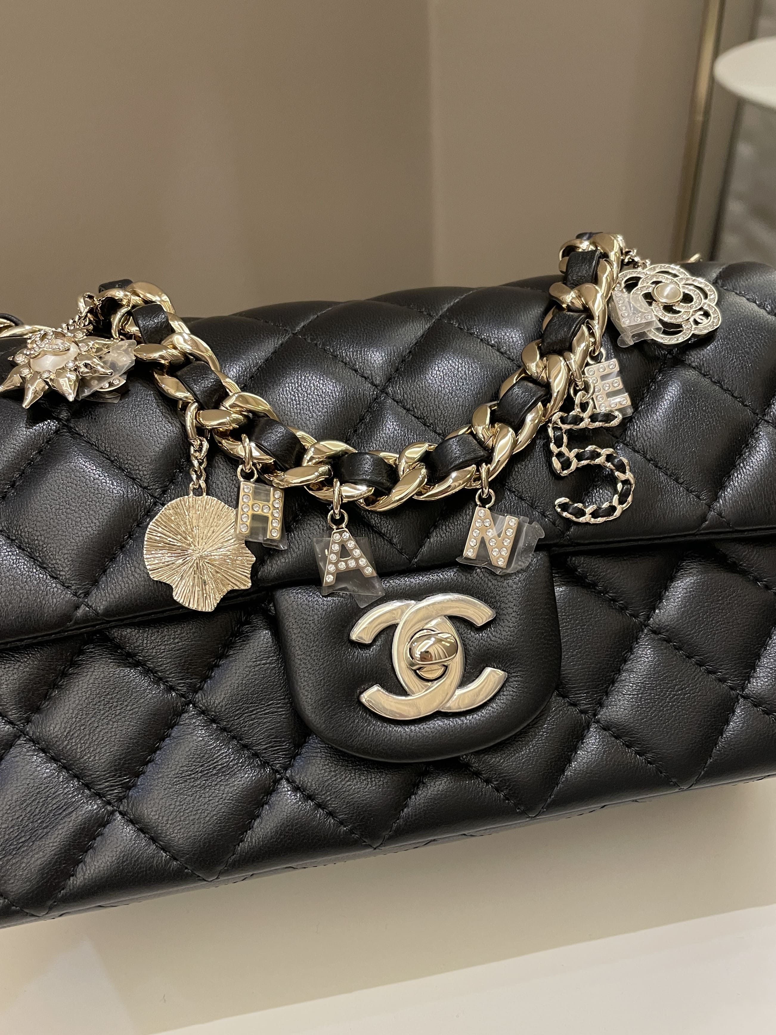 Chanel Quilted Mini Coco Charms Rectangular Flap Black Lambskin